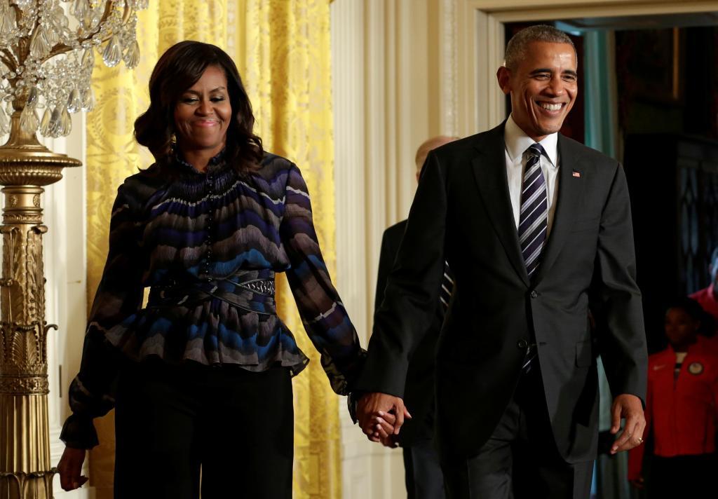 President Barack Obama arrives with First lady Michelle Obama