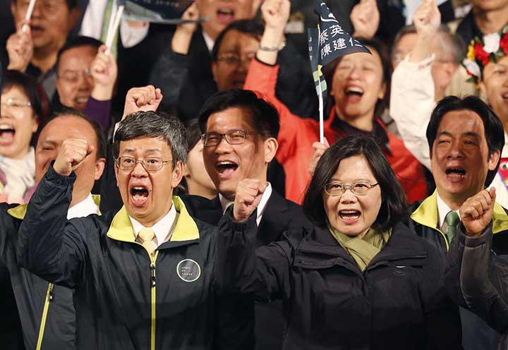 Taiwan's Democratic Progressive Party, DPP, presidential candidate Tsai Ing-wen, right, and her vice presidential running mate Chen Chien-jen celebrate their victory in the presidential election Saturday, Jan. 16, 2016, in Taipei, Taiwan. (AP Photo/Wally Santana)